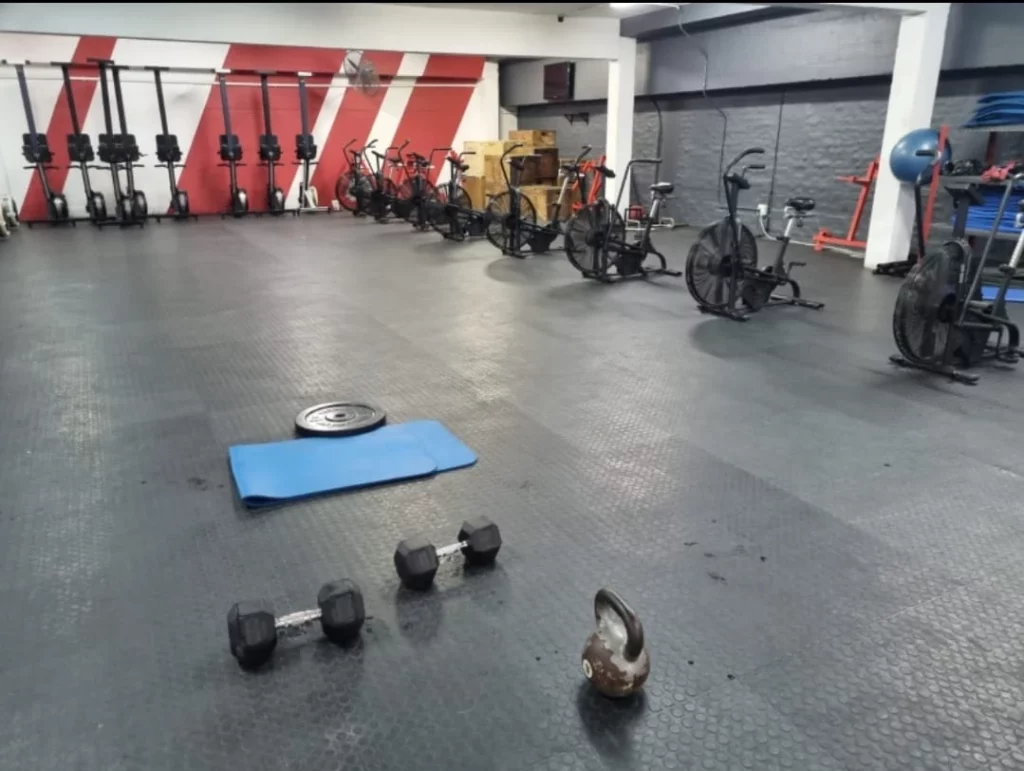 Dumbells and Kettlebells on the gym floor